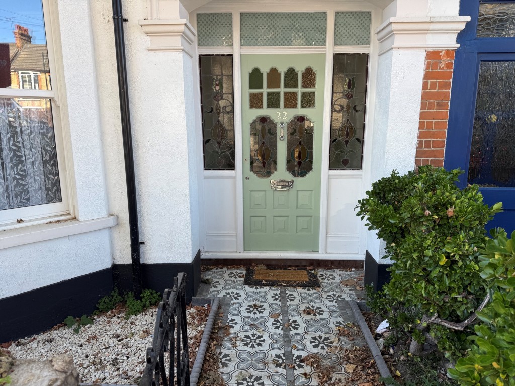 Lot: 132 - THREE-BEDROOM TERRACE HOUSE - Character pathway leading to the front door